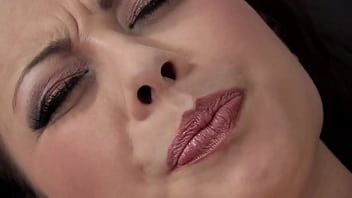 A Raven-haired Milf Pleasures Herself In Sheer Black Stockings, Her Fingers Working Her Wet Cunt.