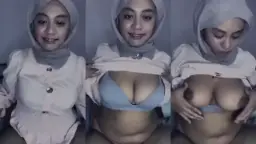 Hijab Girl In Grey Flaunting Her Huge Tits For Attention